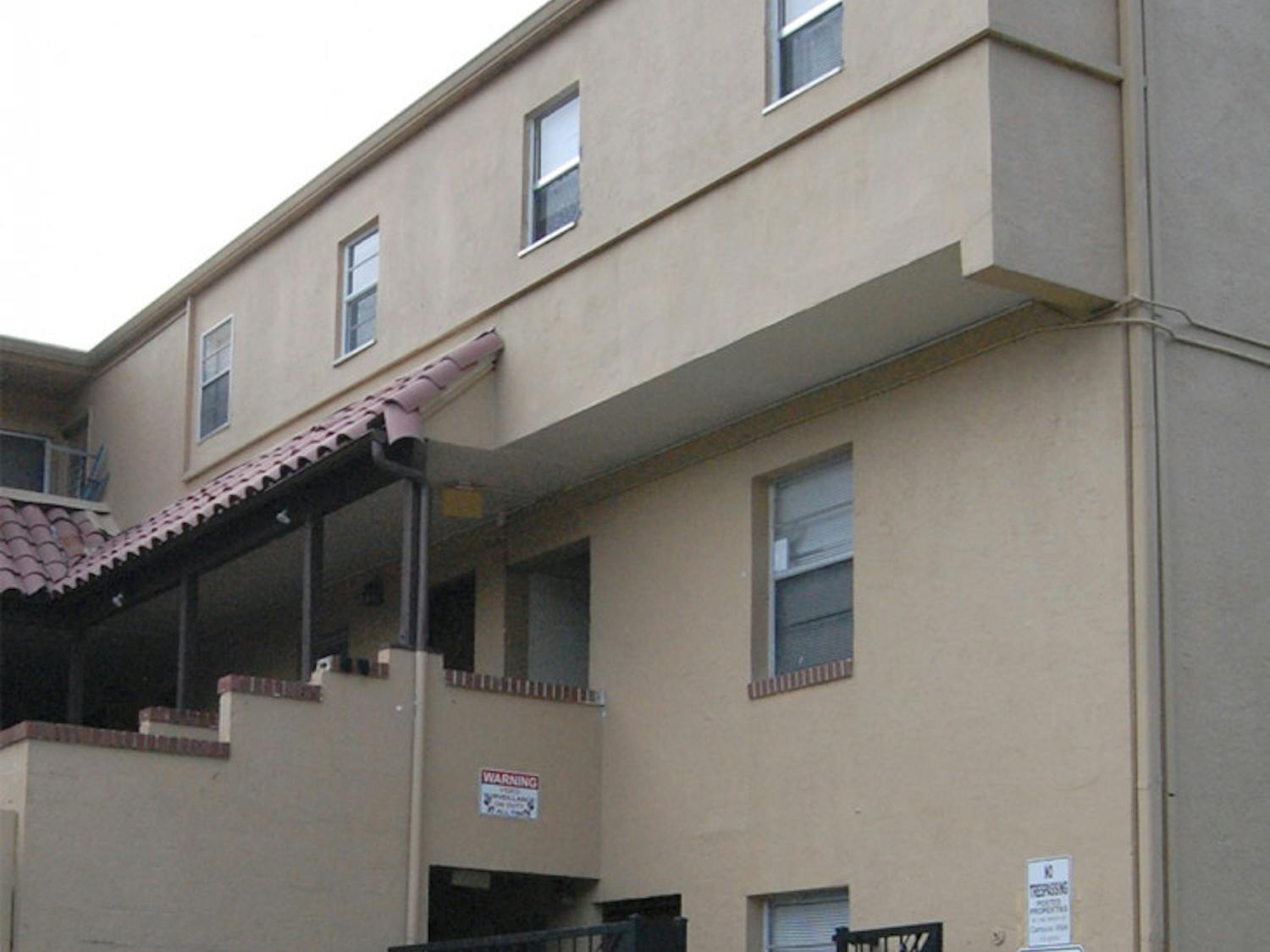 Bullet holes dot the wall at Campus Walk Apartments on Monday. Michael Dennison, 41, fired at apartment 50 on Wednesday after getting into an argument with friends.