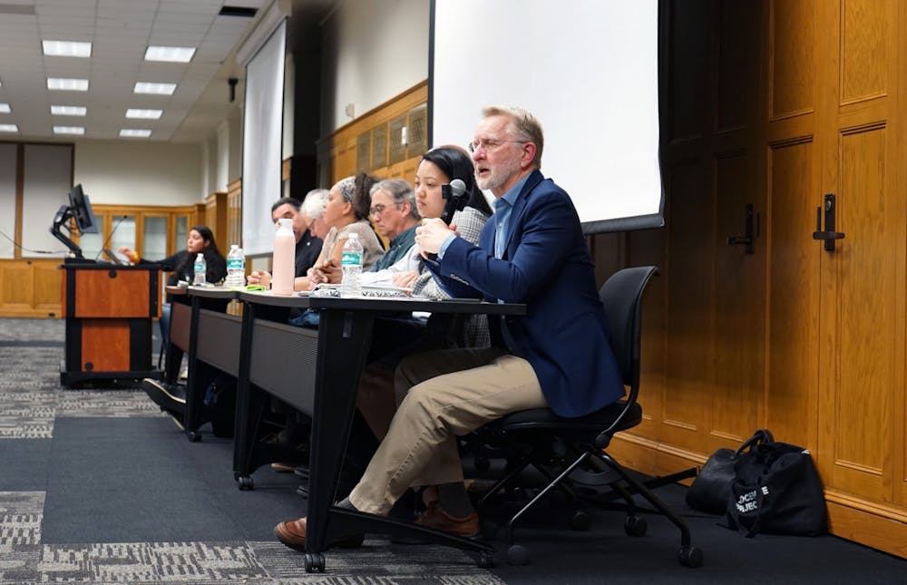 <p>UF historian and task force member Carl Van Ness responds to a question from a student panel at a roundtable discussion on African American and Native American History at Smathers Library Tuesday, Jan. 17, 2023. </p>