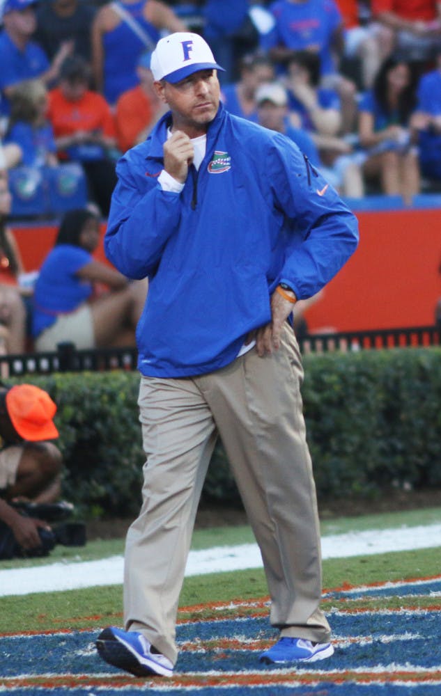 Brent Pease watches on as players go through warm-ups prior Florida’s 30-10 victory against Arkansas on Oct. 5 in Ben Hill Griffin Stadium.