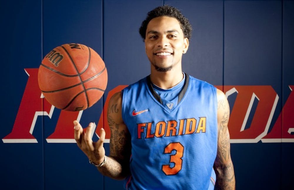 <p>Redshirt senior guard Mike Rosario poses during Florida’s media day on Wednesday. Rosario struggled with injuries and inconsistency in 2011-12, averaging only 14.4 minutes per game.</p>