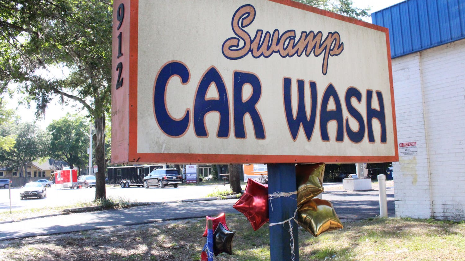 Balloons were tied to the sign of Swamp Car Wash in memory of Bobby Hopkins Jr., on Thursday, May 27, 2021. 