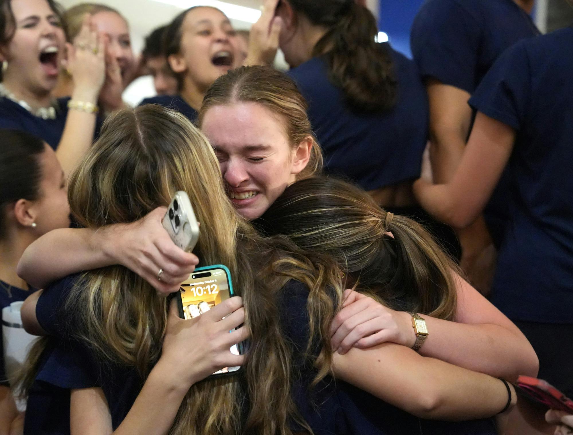 Members of Vision Party cry over their election victory on Wednesday, Oct. 4, 2023. 