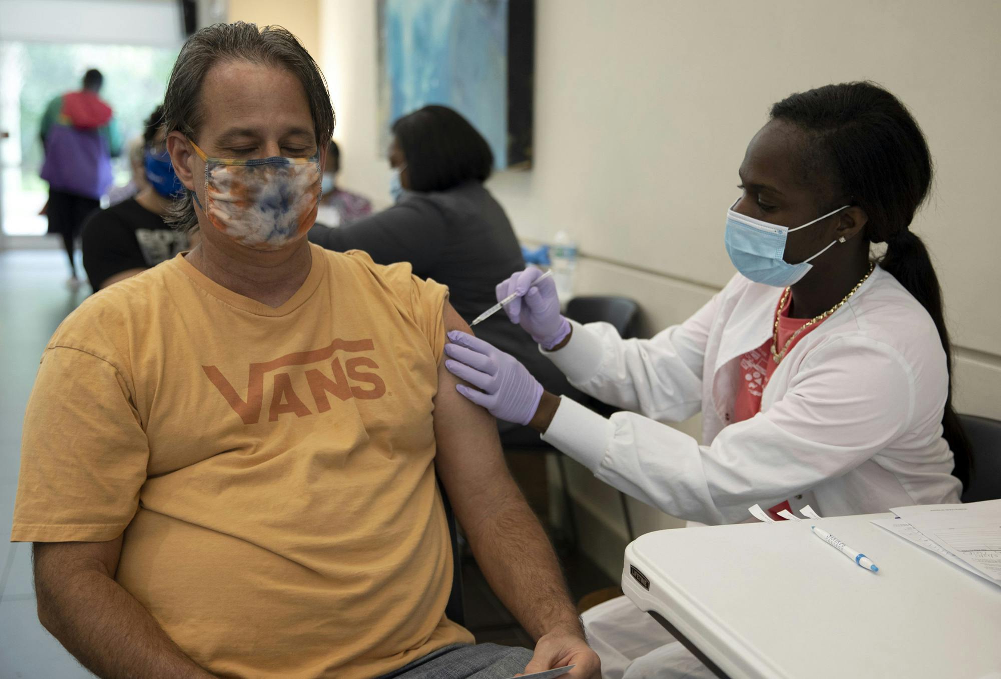Scott Murphey, 52, a Santa Fe college math department professor, gets his second dose of the COVID-19 vaccine Thursday morning at Santa Fe College Jackson N. Sasser Fine Arts Hall, Gainesville, Fla., May 13, 2021. 
