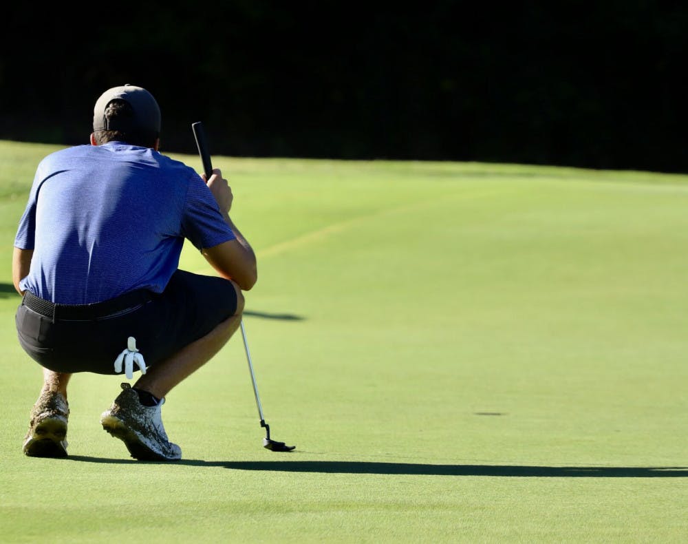 Redshirt sophomore Fred Biondi stares down a hole while practicing at Mark Bostick Golf Course. Biondi led the Gators at Vanderbilt, finishing 15th individually.