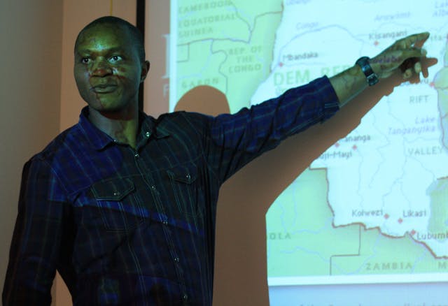 Tshitshi Kalala, a 37-year-old Congo native and sustainable development practice graduate student, speaks to about 15 students at Operation Congo STOP!: An Interactive Awareness Forum.