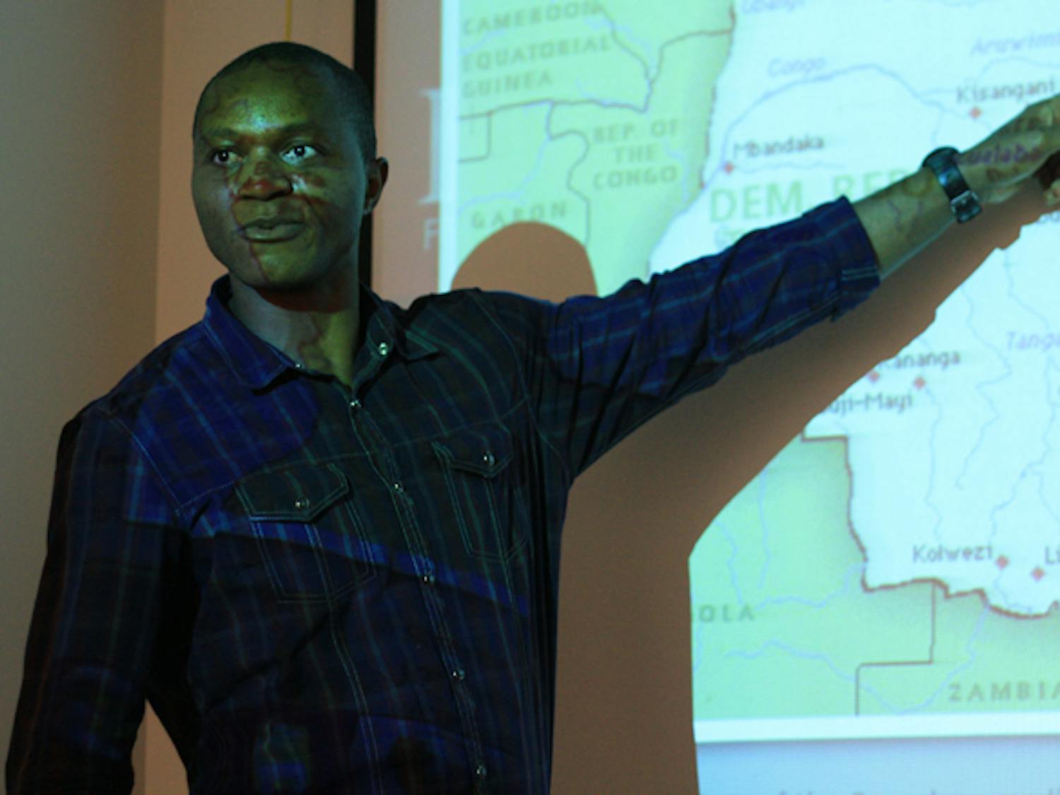 Tshitshi Kalala, a 37-year-old Congo native and sustainable development practice graduate student, speaks to about 15 students at Operation Congo STOP!: An Interactive Awareness Forum.