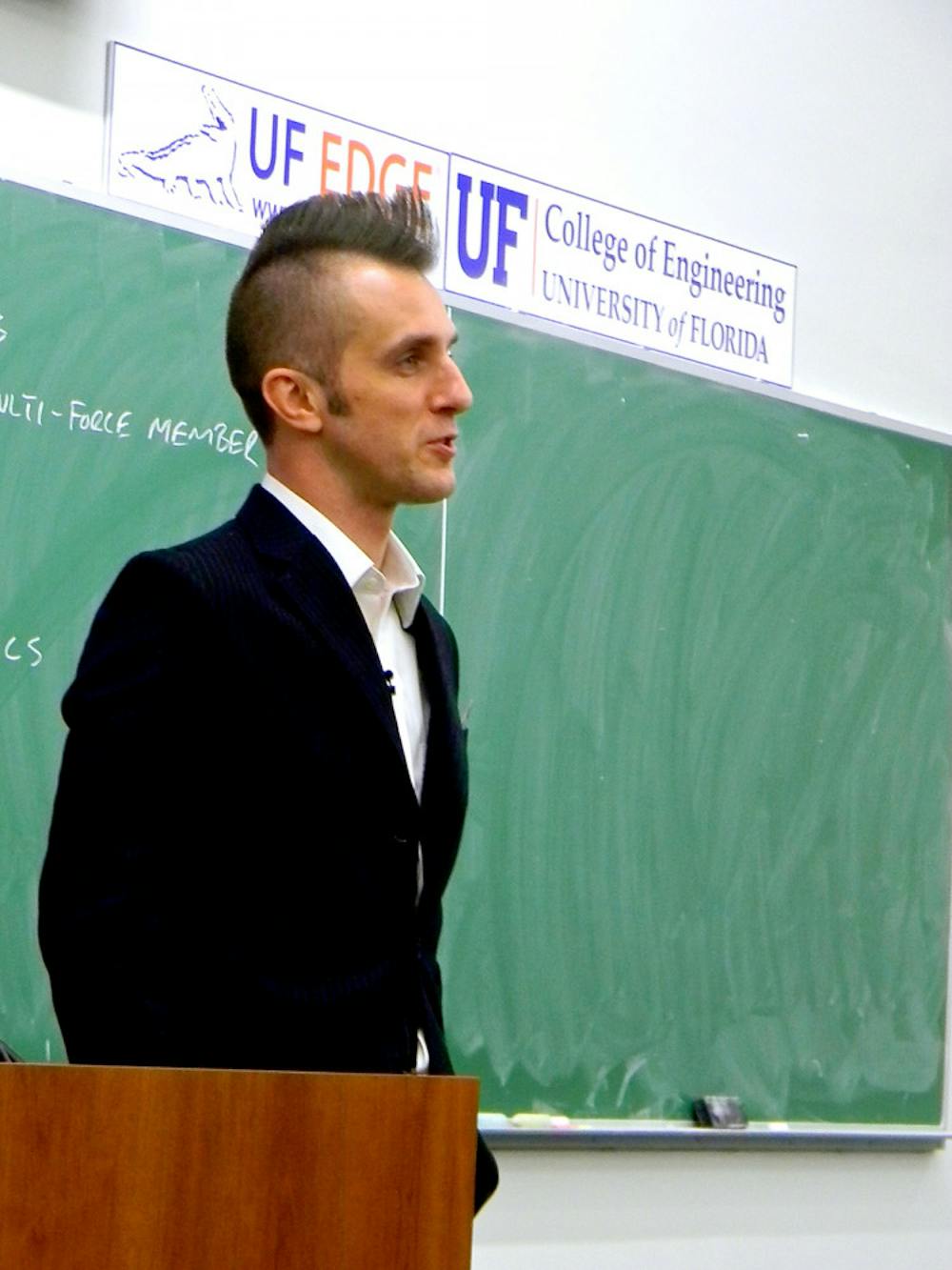 <p class="p1">UF engineering professor Dan Dickrell teaches class Wednesday. The professor shaved his hair into a mohawk for basketball season in the style of player Will Yeguete.</p>