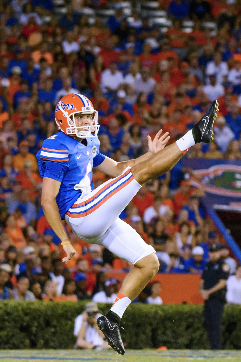 <p>Kyle Christy punts the ball during Florida's 36-30 triple-overtime win against Kentucky on Saturday at Ben Hill Griffin Stadium.</p>