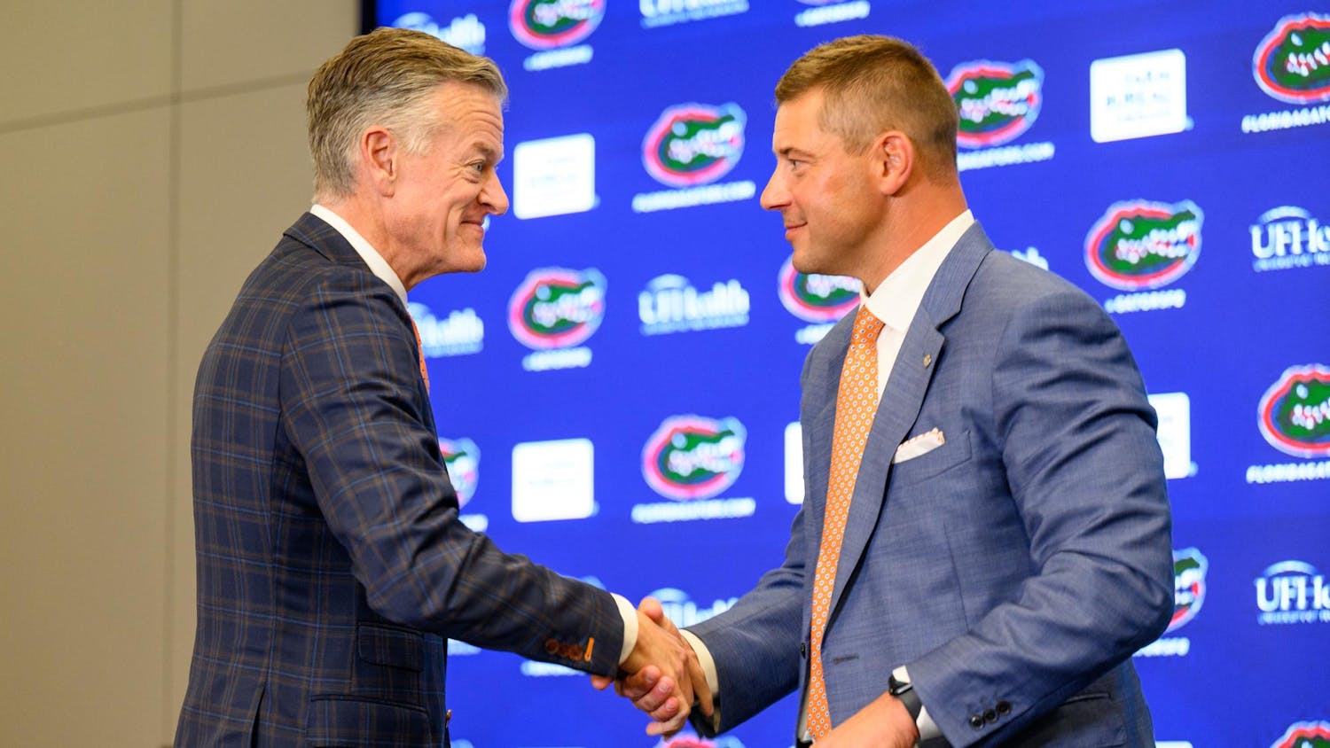 UF’s Athletics Director, Scott Stricklin, shakes Florida head coach Jon Sumrall hand after his introductory press conference at Heavener Football Training Center in Gainesville, Fla., Monday, Dec. 1, 2025.