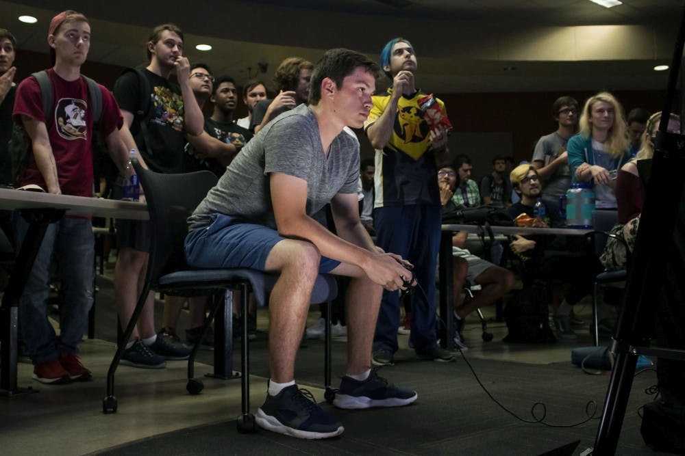  Ryan Erickson, a 19-year-old electrical engineering student, plays Super Smash Bros. Ultimate Friday night during a tournament held in Turlington. Erickson, who goes by the gamertag “Poet,” is one of Gainesville’s top competitive Smash players and is currently ranked as the 4th best player in North Florida. He has competed in local, statewide and nationwide tournaments.