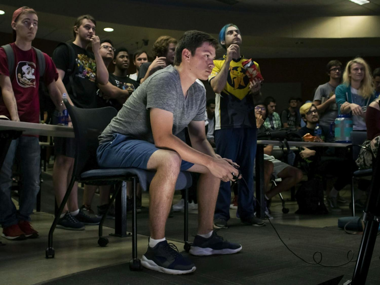  Ryan Erickson, a 19-year-old electrical engineering student, plays Super Smash Bros. Ultimate Friday night during a tournament held in Turlington. Erickson, who goes by the gamertag “Poet,” is one of Gainesville’s top competitive Smash players and is currently ranked as the 4th best player in North Florida. He has competed in local, statewide and nationwide tournaments.