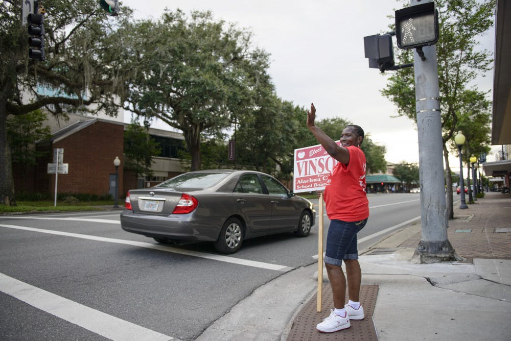 <p>ELECTIONS - Jackie Showers stands outside the Alachua County Supervisor of Elections Office Tuesday evening.</p>
