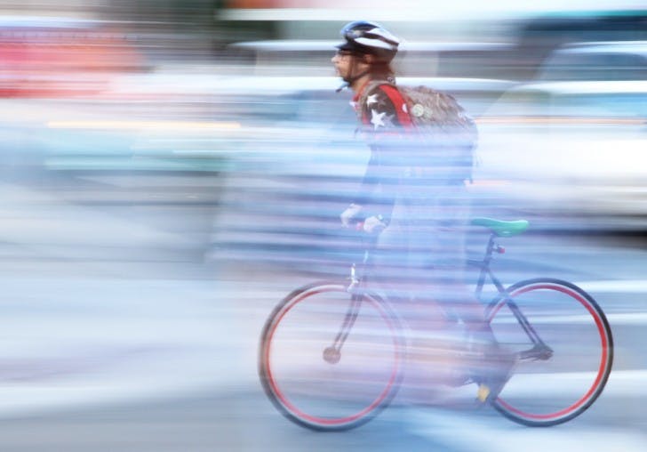 Taylor Affleck, a 25-year-old Jimmy John’s employee, passes West University Avenue and Buckman Drive on Tuesday afternoon while delivering a sandwich to a customer.