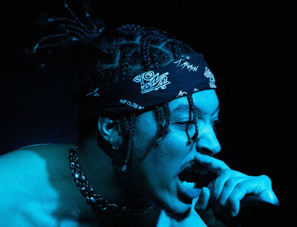 Lonr. raps into the microphone during his set on Friday night at the High Dive. He performed many songs, including his singles, "A.M." and "Safe Zone."&nbsp;&nbsp;