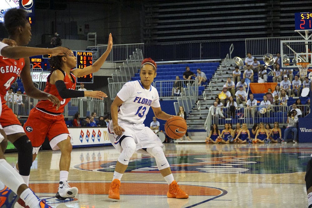 <p>Cassie Peoples looks to pass during Florida's 71-61 loss to Georgia on Jan. 14, 2016, in the O'Connell Center.</p>