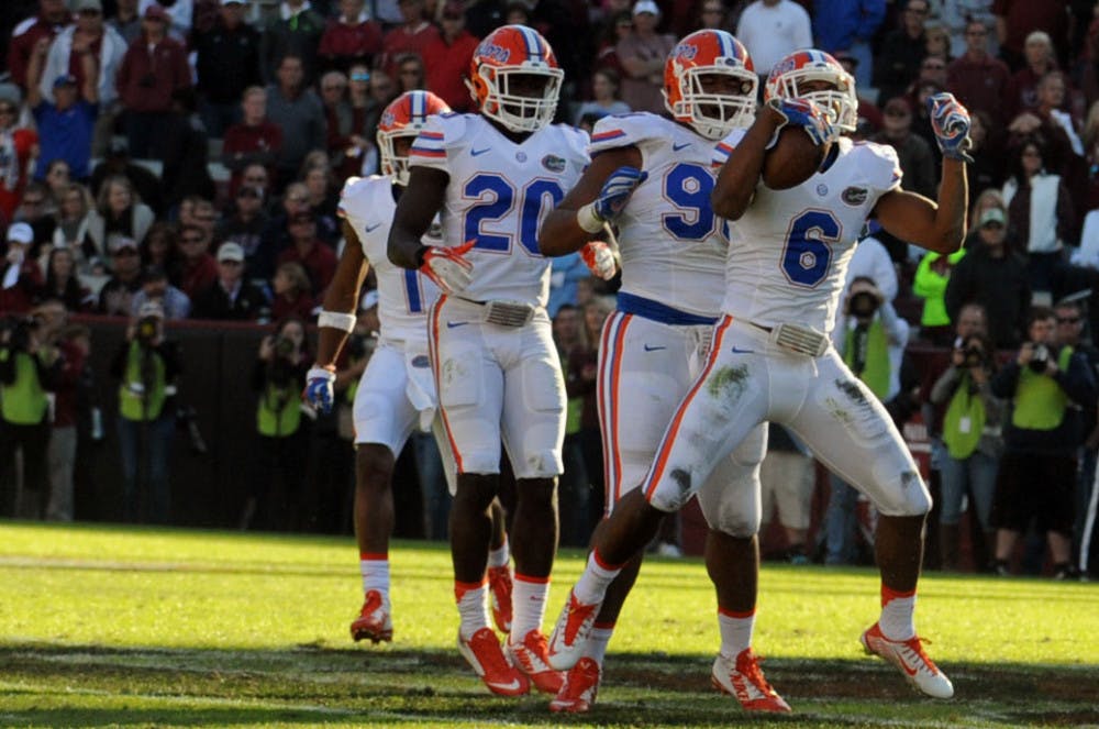 <p>UF defensive back Quincy Wilson (6) celebrates after catching an interception in the waning seconds of Florida's 24-14 win against South Carolina on Nov. 14, 2015, at Williams-Brice Stadium in Columbia, South Carolina.</p>