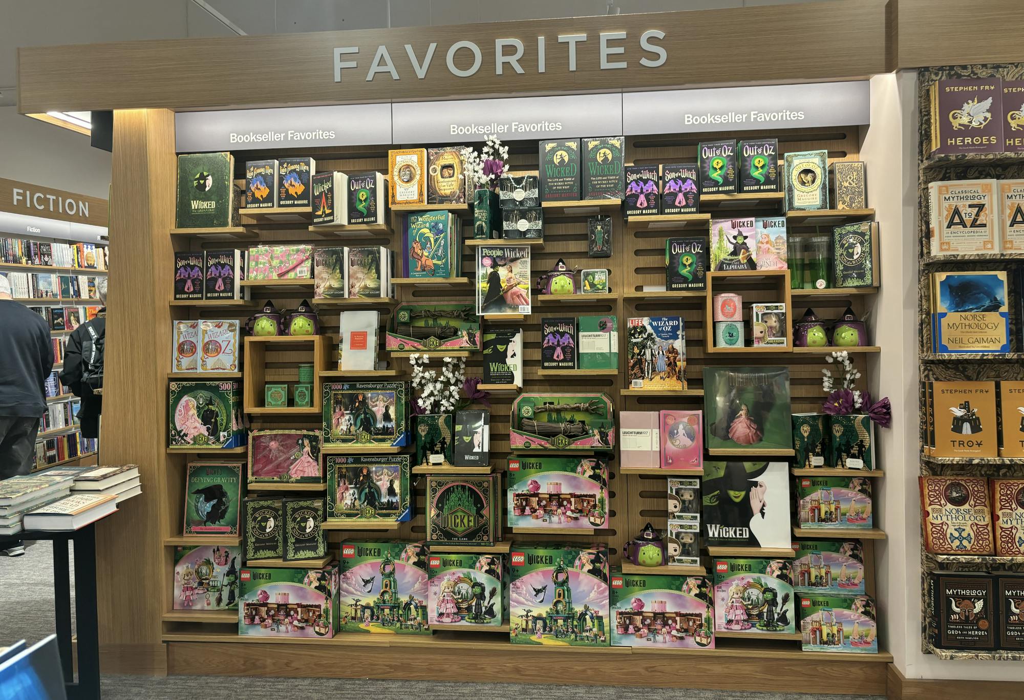 Barnes and Noble bookshelf lined with "Wicked" books and merchandise.