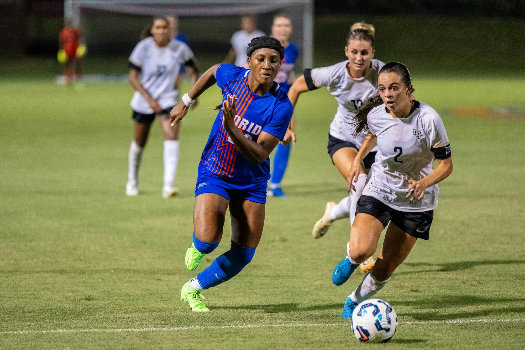 University of Florida soccer player Lena Bailey (29) chases down the ball from University of Central Florida’s Taylor Jacobson (2) in Gainesville, Florida, on Aug. 24, 2024.