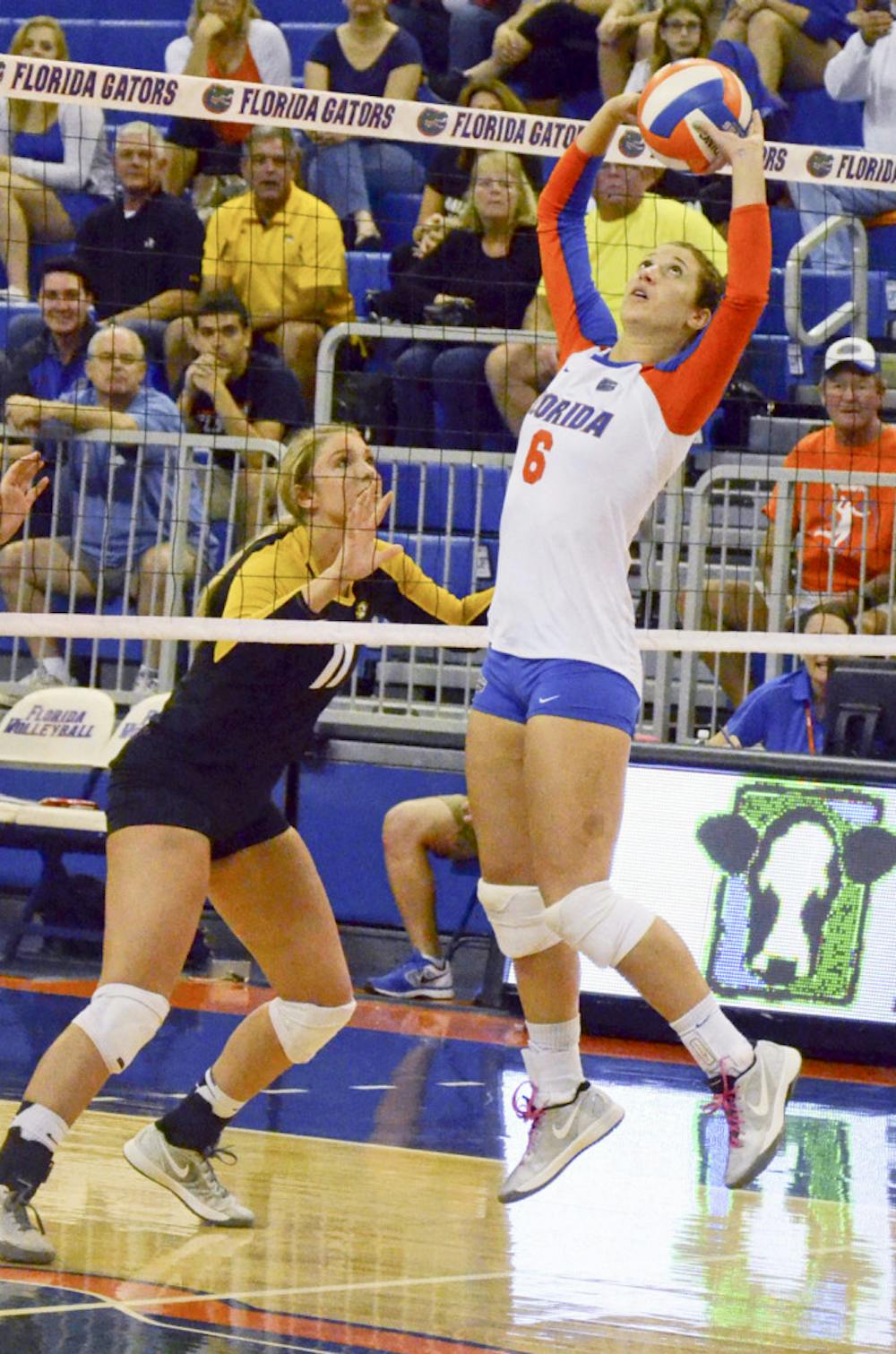 <p>Mackenzie Dagostino sets the ball during Florida's 3-0 win against the Mizzouri on Friday in the O'Connell Center.</p>