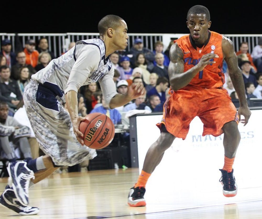 <p>Kenny Boynton (1) plays defense against Georgetown on Nov. 9 aboard the USS Bataan in Jacksonville. Boynton and Scottie Wilbekin will go head-to-head with Georgia’s Kentavious Caldwell-Pope tonight at 7 at the O’Connell Center.</p>
<div><span><br /></span></div>