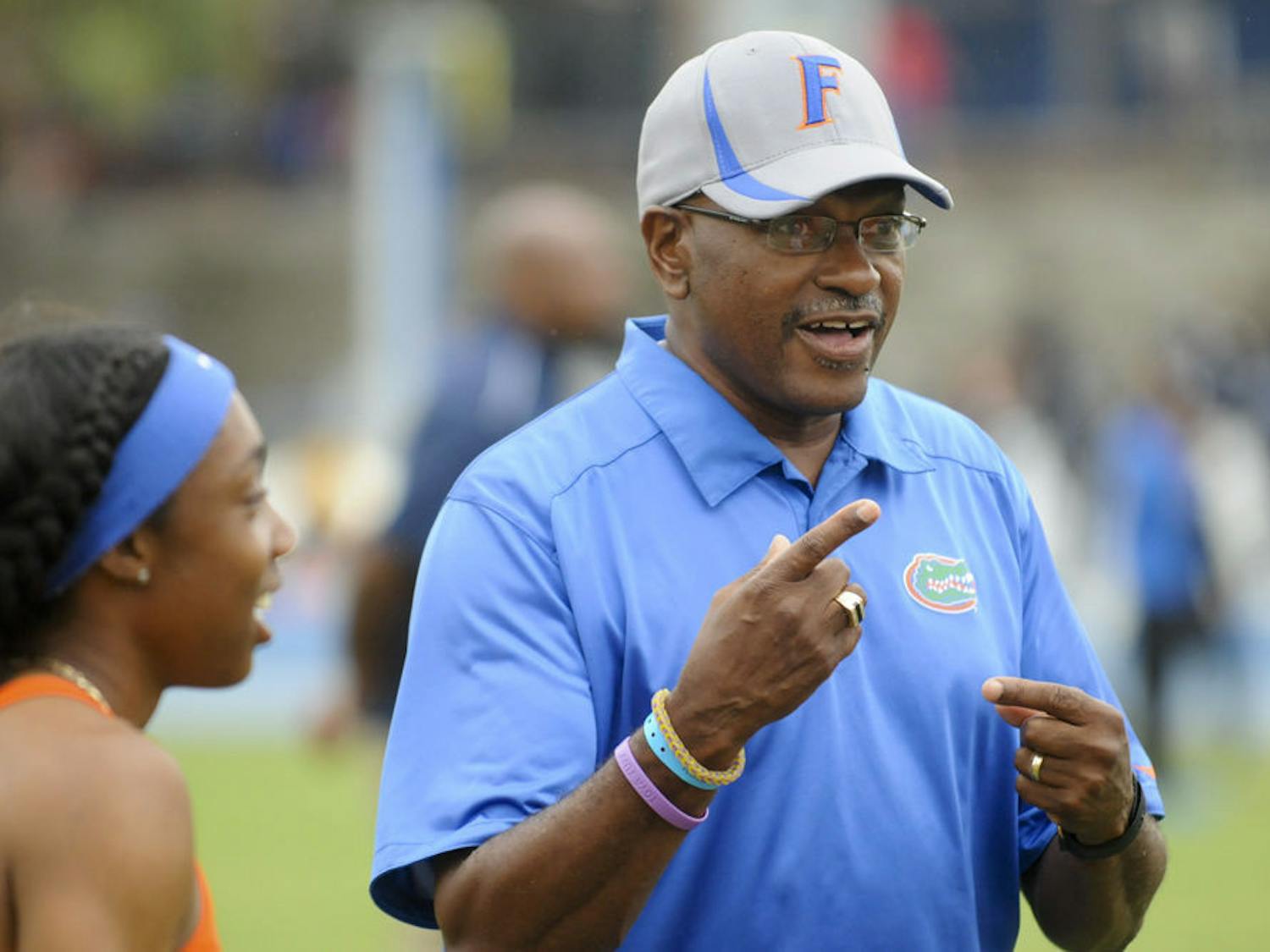 UF coach Mike Holloway smiles as he talks with his team during the 2016 Florida Relays at the Percy Beard Track.
