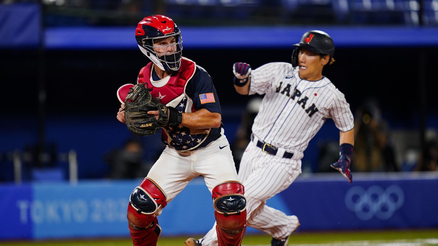 United States catcher Mark Kolozsvary forces out Japan's Masataka Yoshida on a fielder's choice by Japan's Yuki Yanagita during the gold medal baseball game at the 2020 Summer Olympics, Saturday, Aug. 7, 2021, in Yokohama, Japan. (AP Photo/Matt Slocum)
