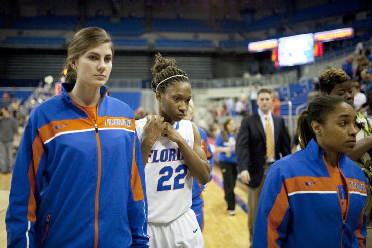 Javier Edwards / Alligator
Center Viktorija Dimaite (left), guard Kayla Lewis (middle) and guard Cassie Peoples (right) walk off the court following Florida’s 88-81 loss to Ole Miss on Thursday in the O’Connell Center.
