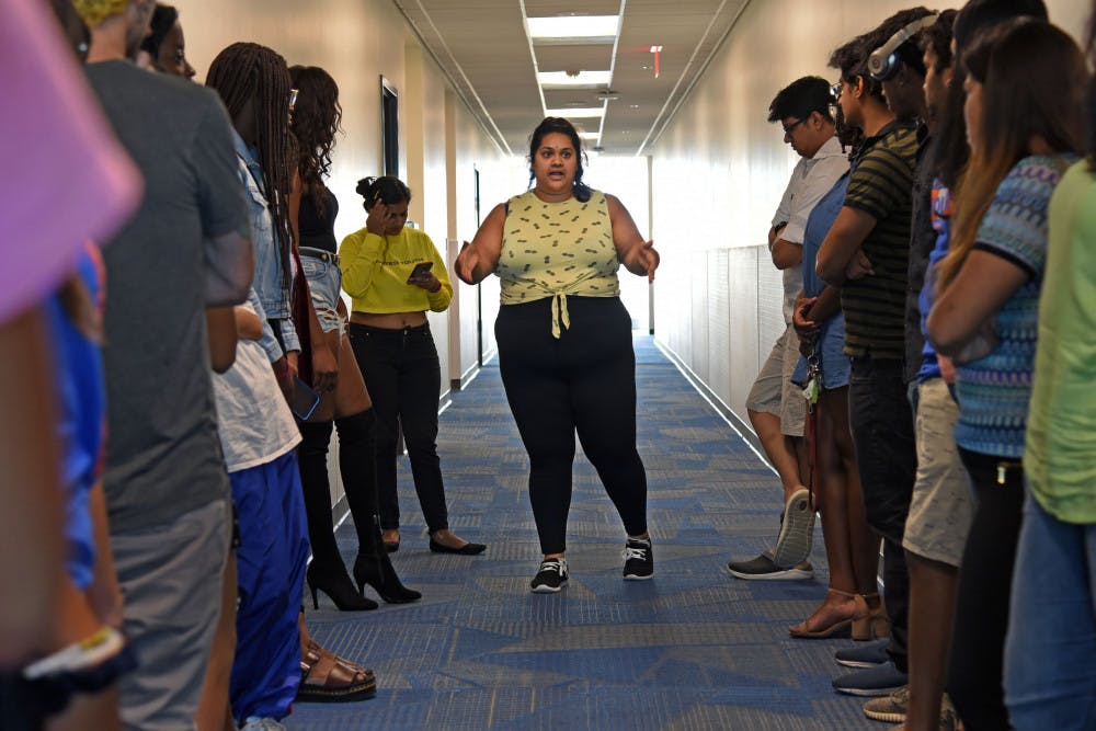 Yashu Rao, 27, a third-year UF materials science and engineering doctoral student, directs participants at the fashion rehearsal Thursday afternoon for the upcoming Indo-Western Fashion Show Oct. 18 at the Reitz Union Rion Ballroom. 