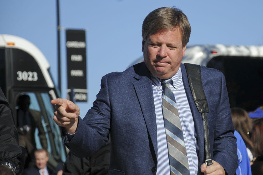 <p>UF coach Jim McElwain points to the crowd during Gator Walk prior to Florida's 24-14 win against South Carolina on Nov. 14, 2015, in Columbia, South Carolina.</p>
