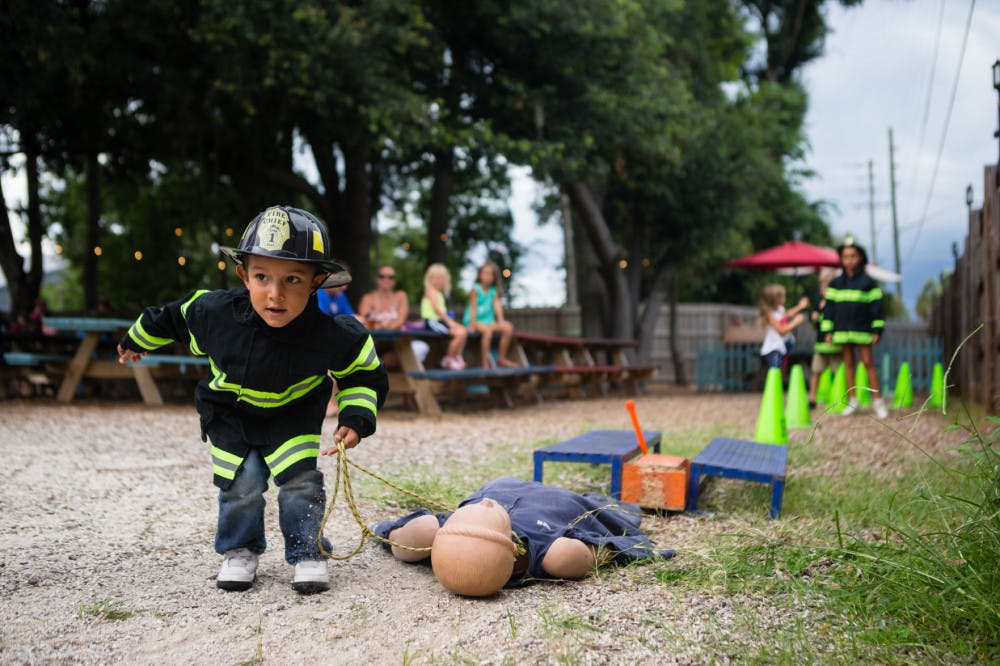 Children participated in a “Kiddie Combat” obstacle challenge during the “Sausages for Safety” fundraiser. Read the story here.&nbsp;