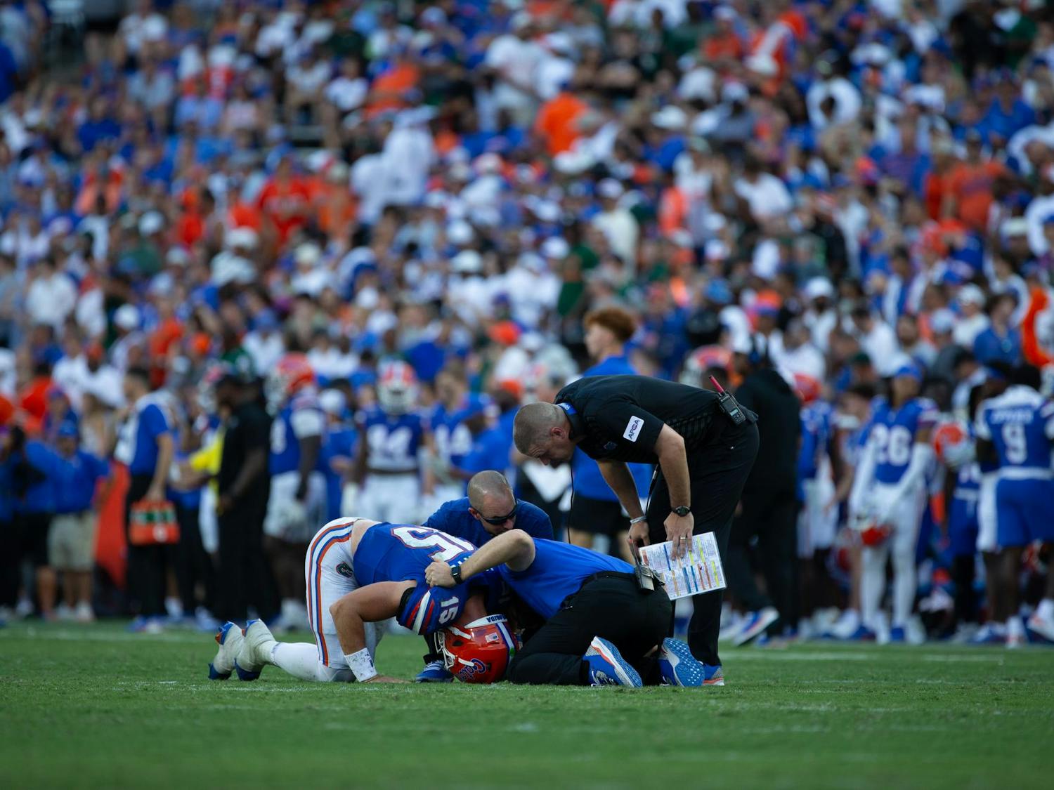 Florida quarterback Graham Mertz kneels down on the field after being injured during the third quarter of the Gator's game vs the Miami Hurricanes on Saturday, Aug, 31.