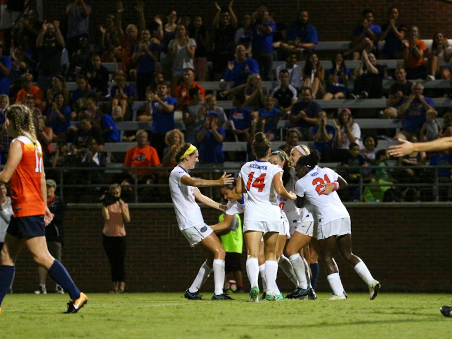 Florida players celebrate during UF's 2-1 win against Syracuse on Sunday at Donald R. Dizney Stadium.