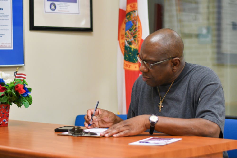 Harry Jones, a 61-year-old formerly incarcerated Alachua County resident, registers to vote Tuesday, Jan. 8, 2019, at the Alachua County Supervisor of Elections office. Jones, who has been out of prison for 13 years, had his right to vote restored after Amendment 4 passed in the 2018 midterm election. Tuesday was the first day Amendment 4 was put into effect. About 50 people registered to vote in Alachua County, said TJ Pyche, the elections office spokesperson.