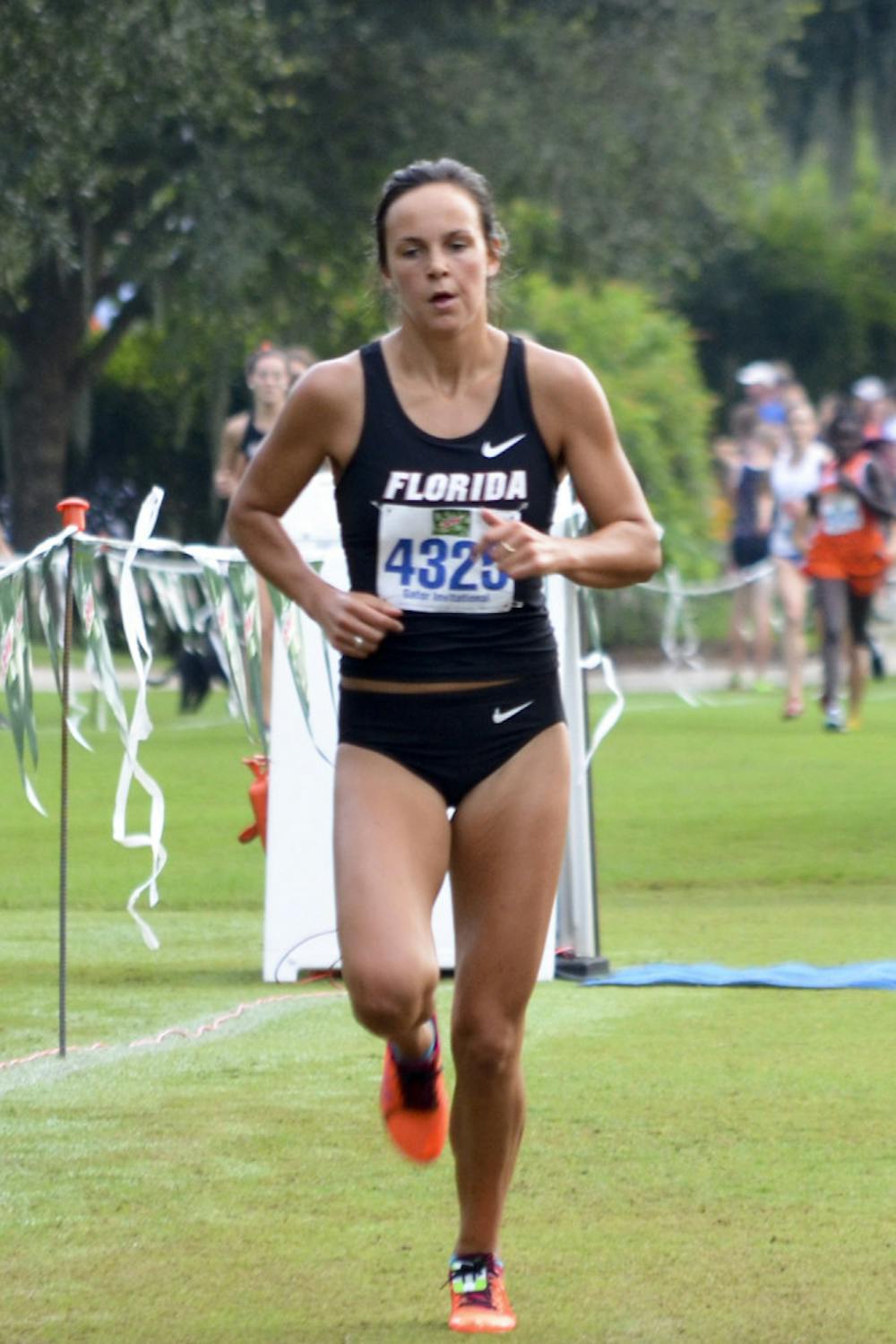 <p>Becky Greene races during the 2014 Mountain Dew Invitational on UF's Mark Bostick Golf Course.</p>