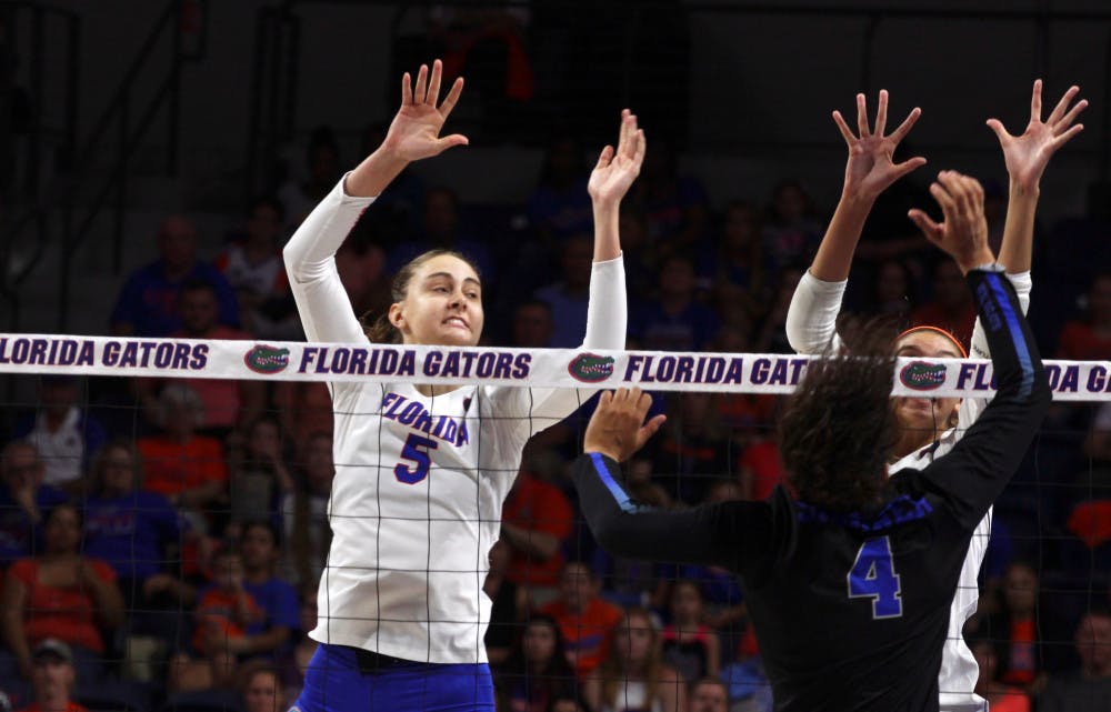 Rachael Kramer goes up for a block during Florida's 3-1 loss to Kentucky on Oct. 15, 2017, at the O'Connell Center. Kramer recorded 11 kills in a win against Mississippi State on Sunday.