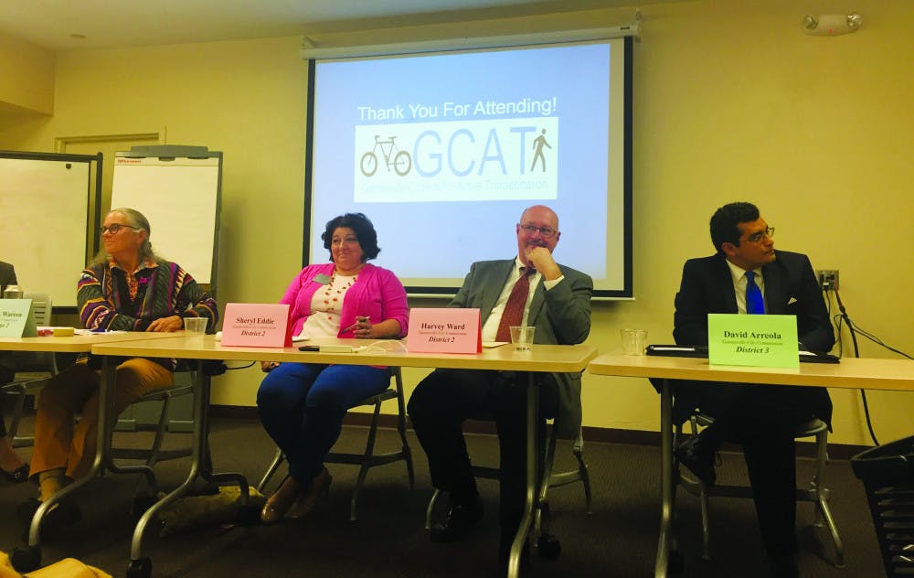 At the third annual candidate forum on Monday, Alachua County City Commission candidates Sheryl Eddie, Helen Warren and Harvey Ward address Gainesville citizens about transportation in Gainesville.