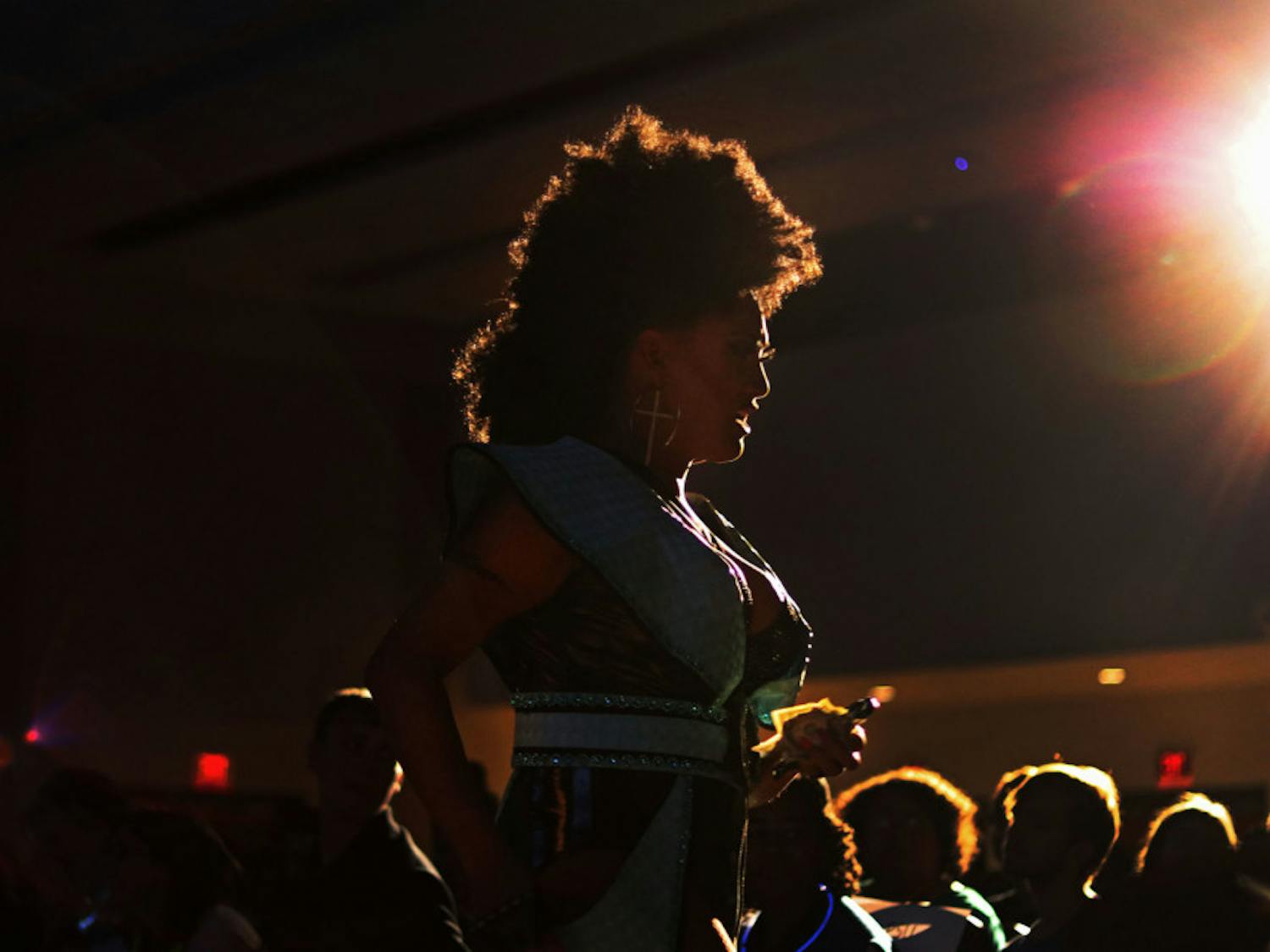 Faith Taylor walks into the crowd of over 250 people Monday night during the Illuminate show in the Rion Ballroom at the Reitz Union.&nbsp;