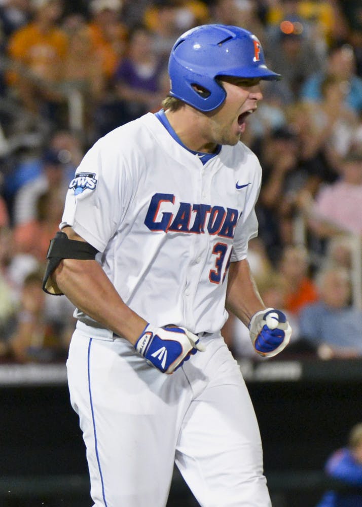 Florida's Brian Johnson yells after lining out to South Carolina right fielder Adam Matthews in the seventh inning of an NCAA College World Series baseball game in Omaha, Neb., Saturday, June 16, 2012.