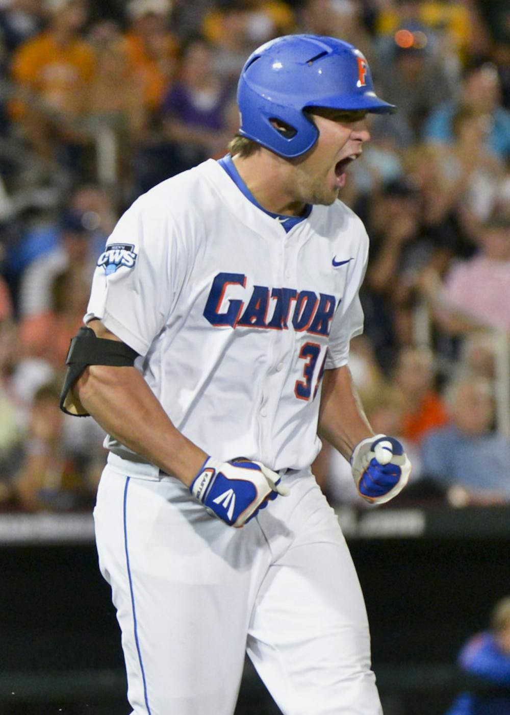 <p>Florida's Brian Johnson yells after lining out to South Carolina right fielder Adam Matthews in the seventh inning of an NCAA College World Series baseball game in Omaha, Neb., Saturday, June 16, 2012.</p>