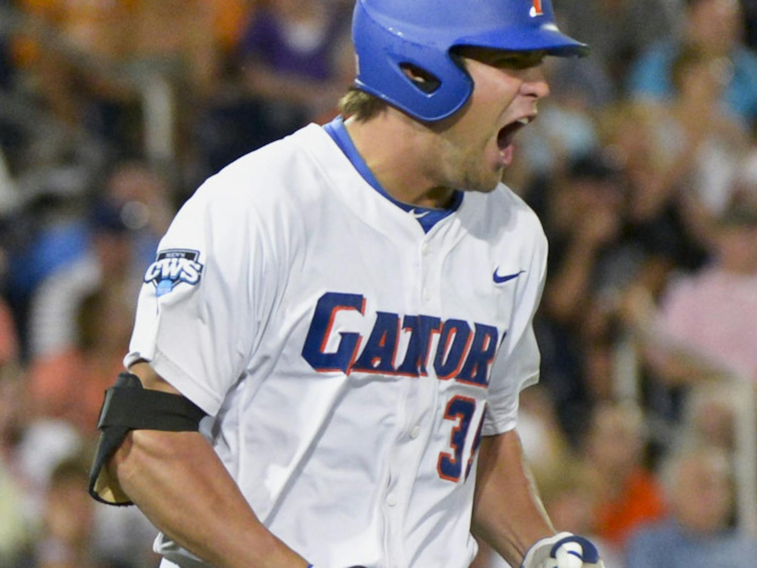 Florida's Brian Johnson yells after lining out to South Carolina right fielder Adam Matthews in the seventh inning of an NCAA College World Series baseball game in Omaha, Neb., Saturday, June 16, 2012.
