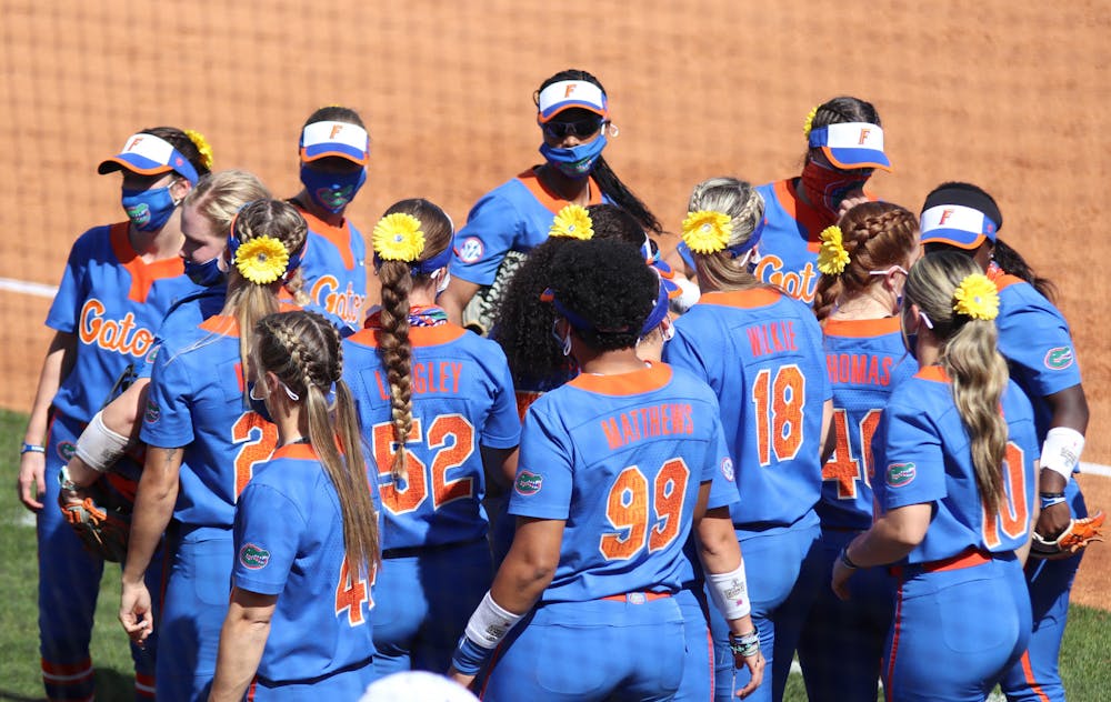 The Florida softball team huddles on February 27 in a game against Louisville. The Gators' season ended Saturday with a second straight Super Regional loss to Georgia.