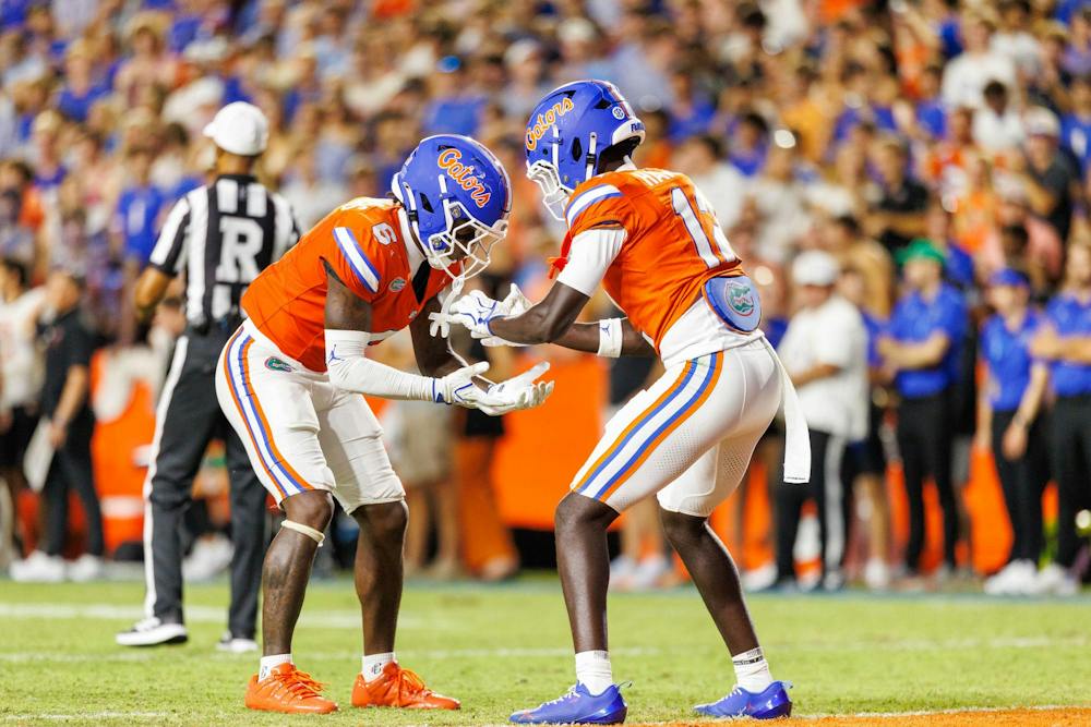 Florida cornerback J'Vari Flowers (6) and cornerback Ben Hanks III (12) celebrate during the second half of an NCAA college football game against Campbell, Saturday, Sept. 12, 2026, in Gainesville, Fla.