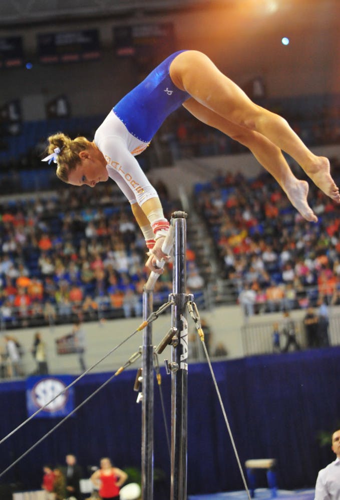 Freshman Bridget Sloan performs her bar routine during Florida's 198.10-196.85 win against Alabama on Feb. 8 in the O'Connell Center. Sloan won the all-around title at the SEC Championship meet on Saturday.
