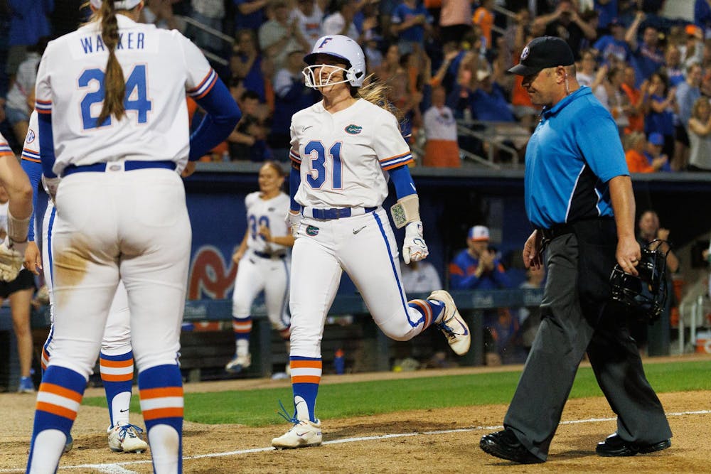 Florida infielder Kenleigh Cahalan (31) celebrates hitting a homerun during an NCAA softball game against Mississippi State, Friday, April 3, 2026, in Gainesville, Fla.