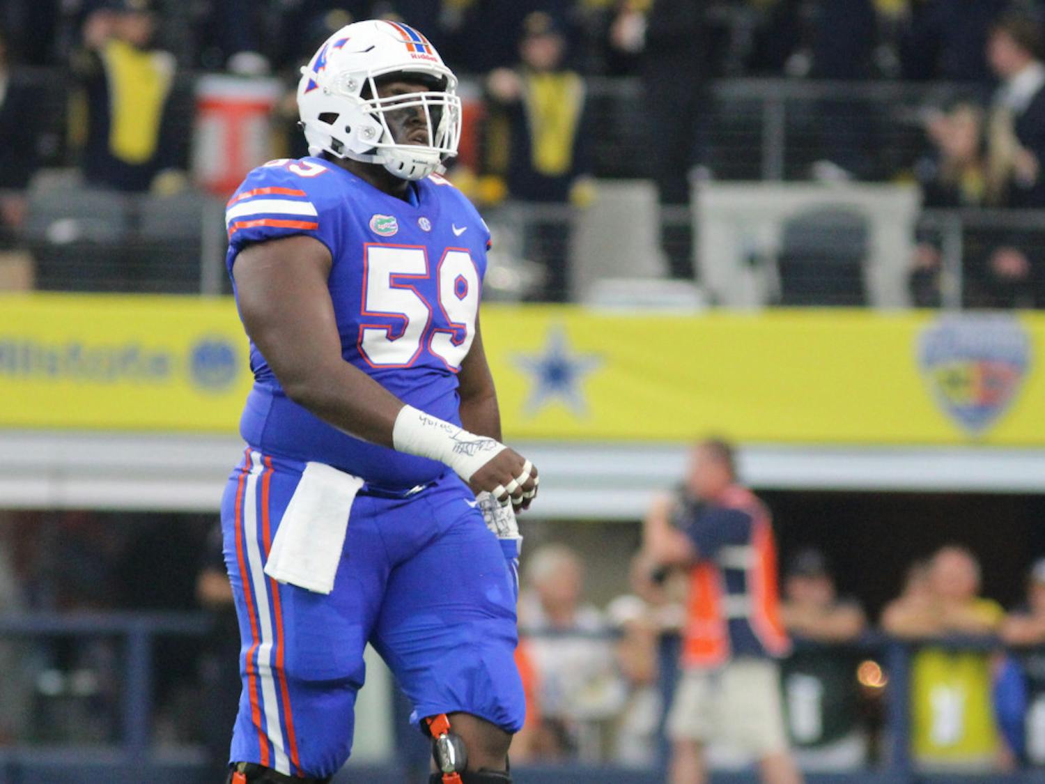 T.J. McCoy walks onto the field during Florida's 33-17 loss against Michigan on Sept. 2, 2017 at AT&T Stadium in Arlington, Texas.
