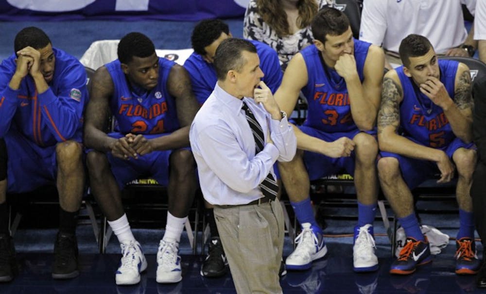 <p>Florida coach Billy Donovan and players (from left to right) Walter Pitchford, Casey Prather, Mike Rosario, Cody Larson and Scottie Wilbekin look on during Saturday’s three-point loss to No. 1 Kentucky.</p>