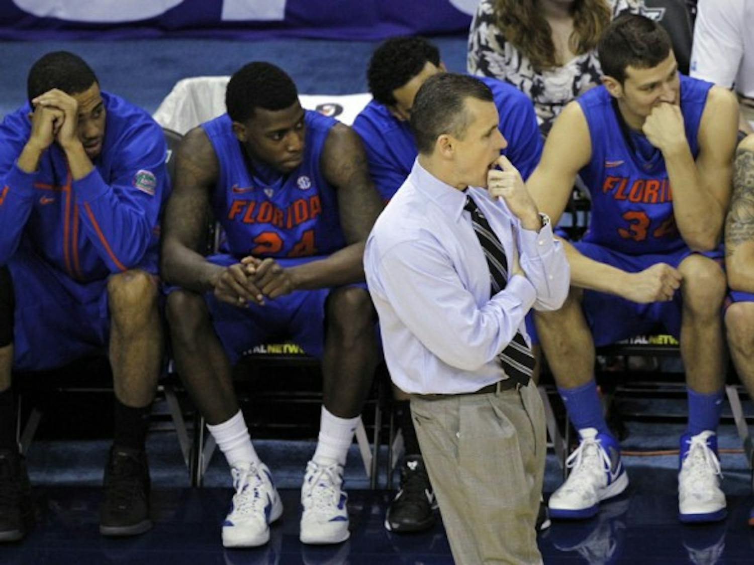 Florida coach Billy Donovan and players (from left to right) Walter Pitchford, Casey Prather, Mike Rosario, Cody Larson and Scottie Wilbekin look on during Saturday’s three-point loss to No. 1 Kentucky.