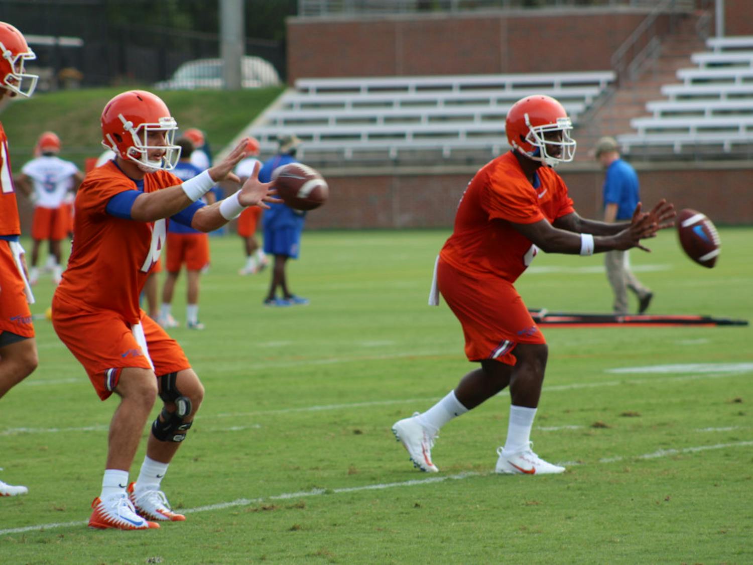Coach Jim McElwain has yet to make clear which of his top three QBs —  Luke Del Rio (left), Malik Zaire (right) and Feleipe Franks — will start. 