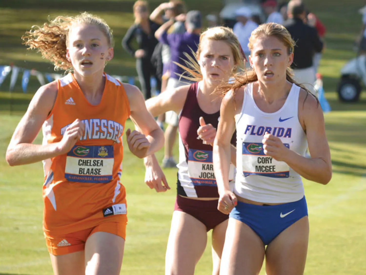 Cory McGee (right) runs at the Southeastern Conference Cross Country Championships at the Mark Bostick Golf Course on Nov. 23, 2013. She won the 800-meter run at the UAB Invite.