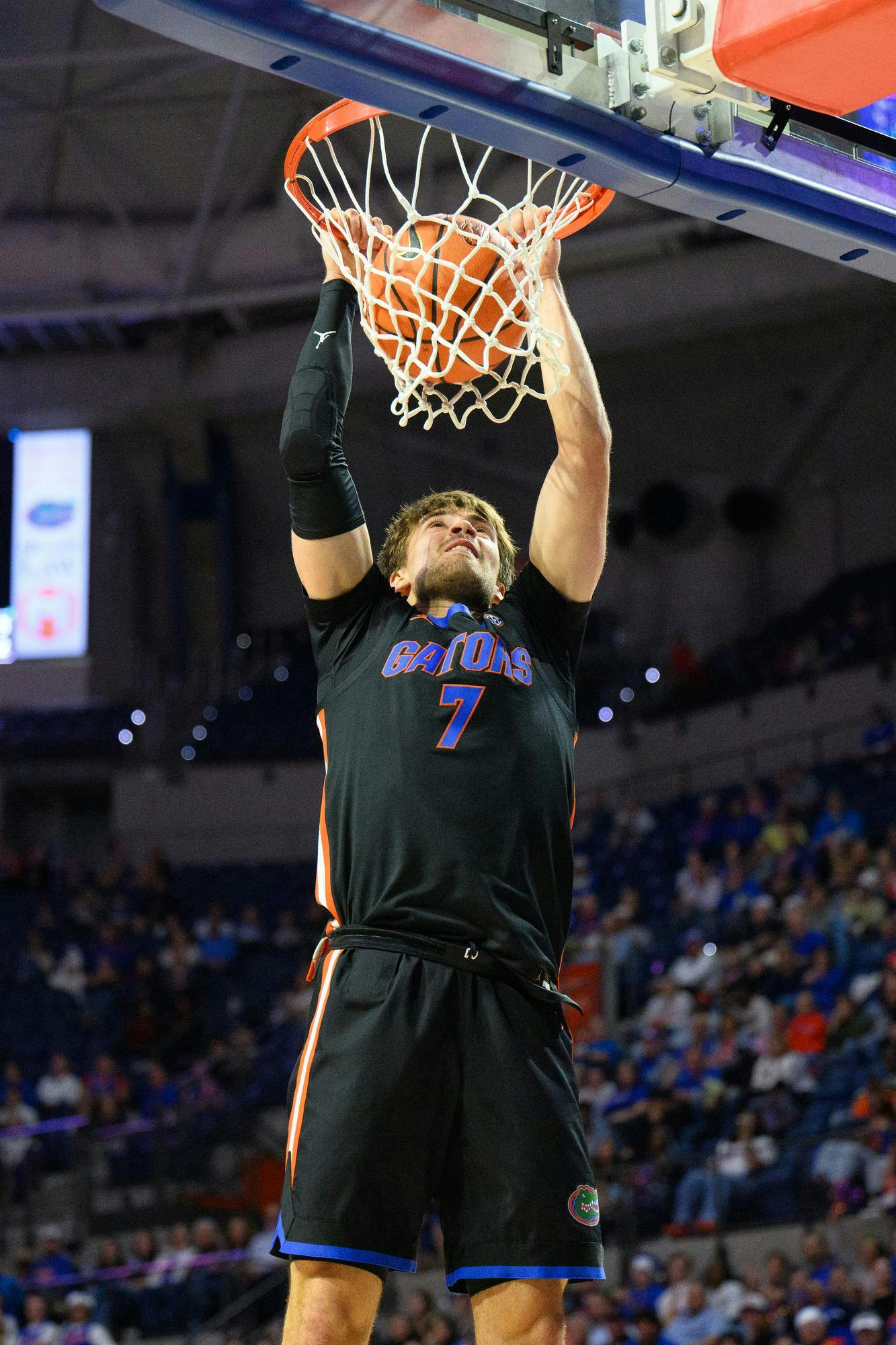 Florida guard Urban Klavzar (7) dunks during the second half of an NCAA college basketball game against Saint Francis, Wednesday, Dec. 17, 2025, in Gainesville, Fla.